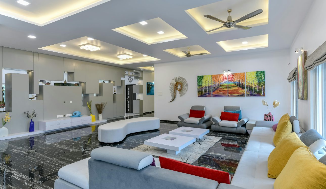Luxury living room interior with modern furniture, warm lighting, and an elegant neutral palette—styled by a Mumbai-based residential interior designer.
