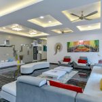 Luxury living room interior with modern furniture, warm lighting, and an elegant neutral palette—styled by a Mumbai-based residential interior designer.