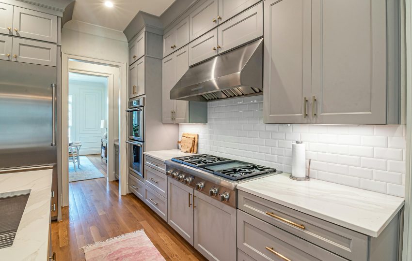 Modern 4BHK luxury kitchen design featuring marble island, smart appliances, and ambient lighting for 2025 homes.