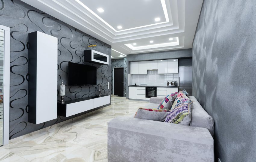 Before and after premium interior design transformation of a luxury apartment in Mumbai showing modern living room, bedroom, and kitchen makeover.